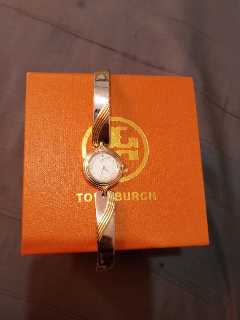 Ungaro Watch Two Tone Bangle (Category: Women's Watches) located in Manila. Submitted by wildwind_73f77a (Listing ID 1461642560, Image 2). Description: - Authentic Ungaro watch - Elegant two-tone metal bangle (gold & silver accents) - Classic round face with a clean white dial - Versatile: perfect for everyday or special occasions - Fits most wrist sizes.