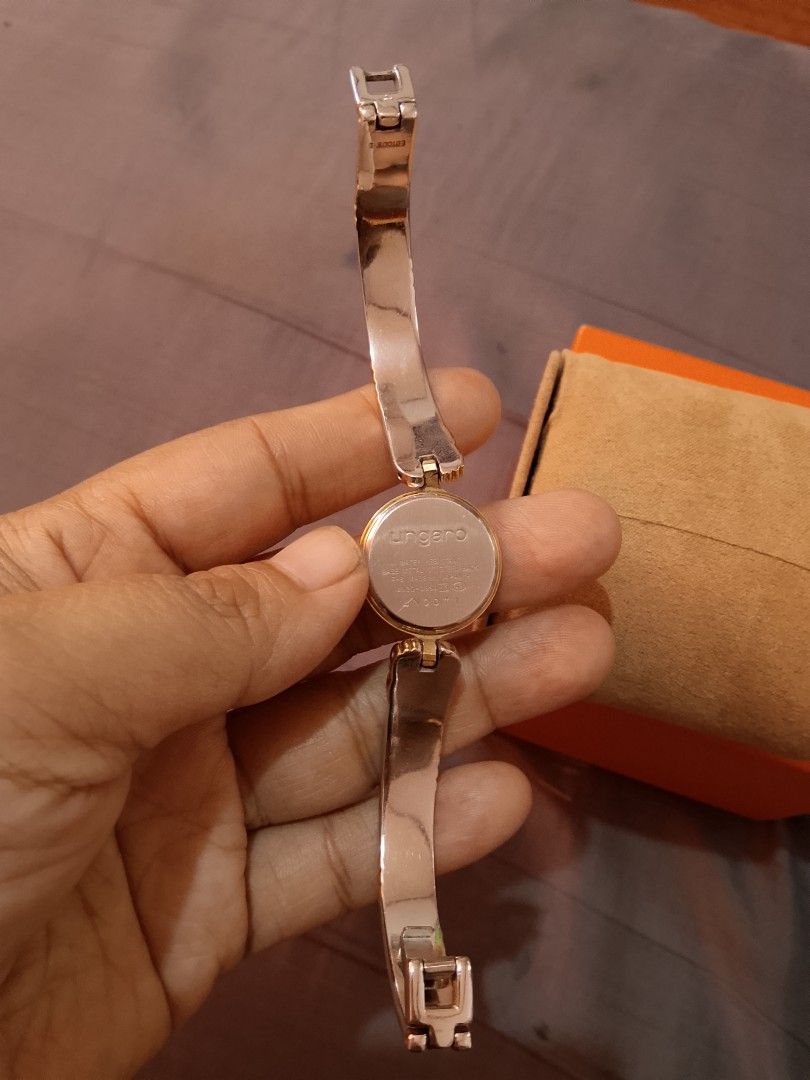 Ungaro Watch Two Tone Bangle (Category: Women's Watches) located in Manila. Submitted by wildwind_73f77a (Listing ID 1461642560, Image 3). Description: - Authentic Ungaro watch - Elegant two-tone metal bangle (gold & silver accents) - Classic round face with a clean white dial - Versatile: perfect for everyday or special occasions - Fits most wrist sizes.