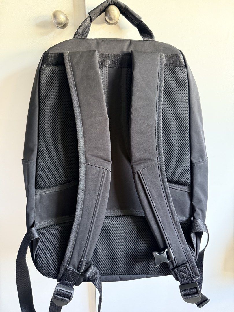 Uniqlo Japan Black Backpack with Multiple Compartments (Category: Backpacks) located in Valenzuela. Submitted by dees.corner (Listing ID 1462061544, Image 3). Description: - Versatile black backpack - Spacious main compartment - Two zippered front pockets for organization - Comfortable padded shoulder straps - Convenient side pockets - Ideal for everyday commutes and travel adventures.