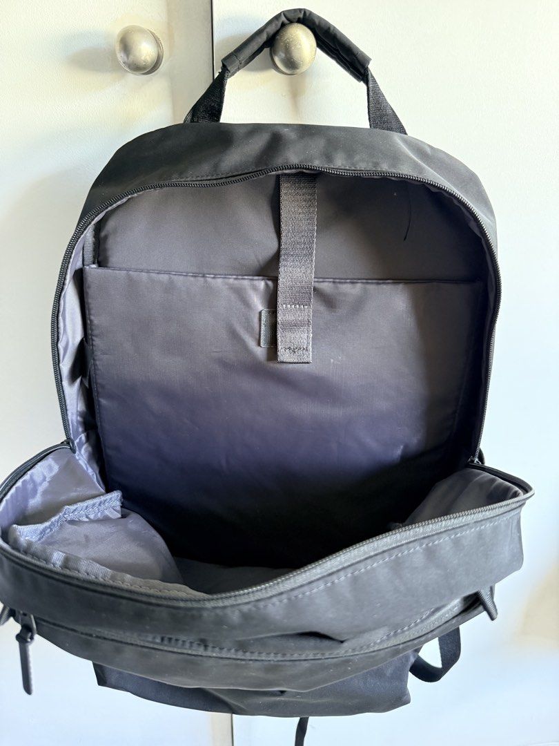 Uniqlo Japan Black Backpack with Multiple Compartments (Category: Backpacks) located in Valenzuela. Submitted by dees.corner (Listing ID 1462061544, Image 2). Description: - Versatile black backpack - Spacious main compartment - Two zippered front pockets for organization - Comfortable padded shoulder straps - Convenient side pockets - Ideal for everyday commutes and travel adventures.