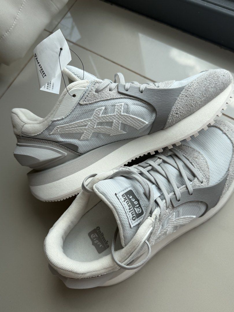 UNISEX Onitsuka Tiger MOAGE CO (Category: Sneakers) located in Quezon City. Submitted by kiseh_opencloset (Listing ID 1462114047, Image 3). Description: - Grey and white Onitsuka Tiger sneakers - Classic design with a modern chunky sole - Ideal for everyday wear - Brand new with original tags attached - Ready for a new home - Unisex - Bought from Taiwan - Size EUR 38/US 5.5 - Website Price ₱16200.