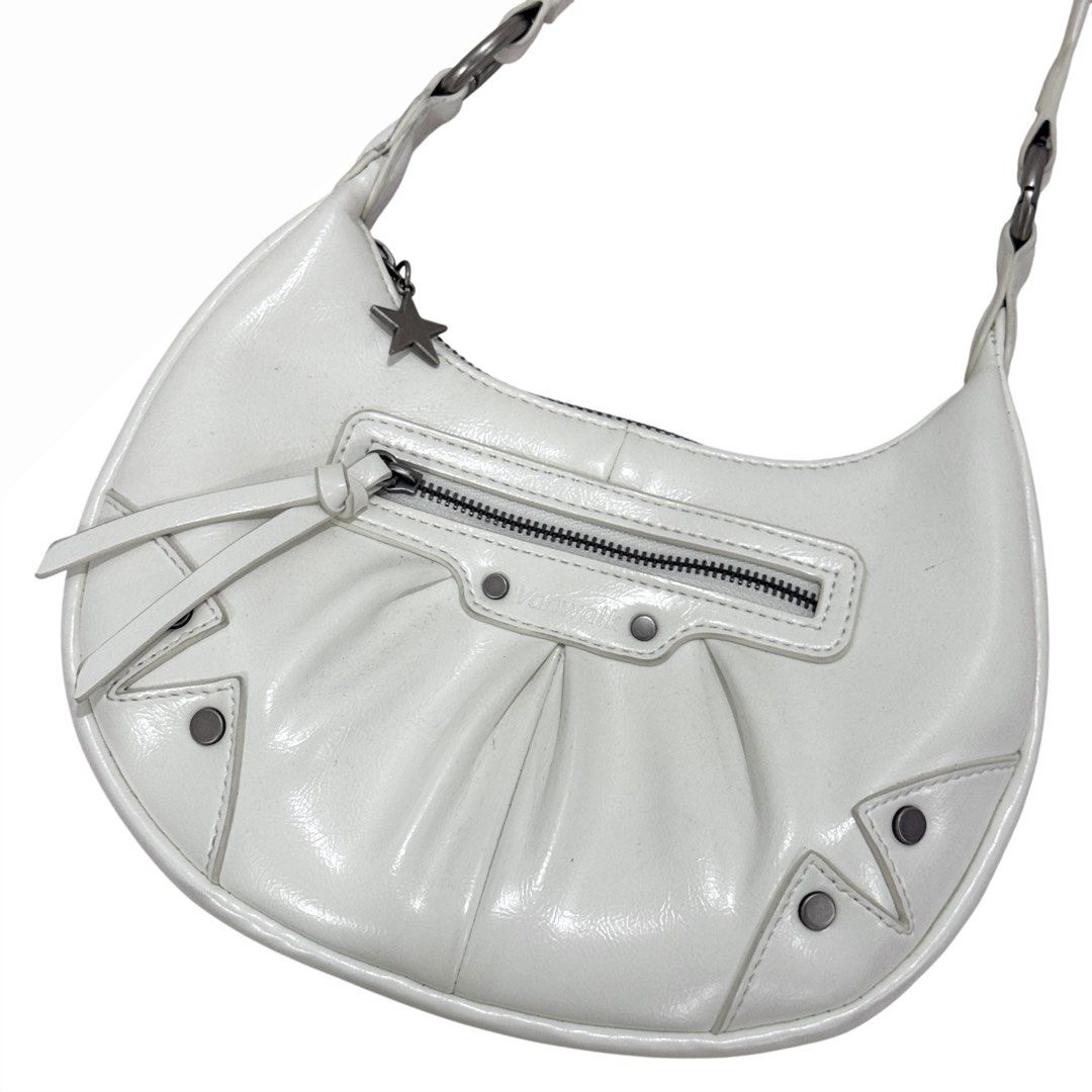 Vanwalk White Patent Leather Shoulder Bag (Category: Shoulder Bags) located in Quezon City. Submitted by nicolerm (Listing ID 1462094778, Image 2). Description: - White patent leather shoulder bag from Vanwalk - Stylish crescent shape - Convenient front zip pocket - Eye-catching stud details on bag and strap - Adjustable strap for comfortable wear - Cute star charm on the zipper pull ★ Used twice only; bought for ₱2,600. Will attempt to wipe off 