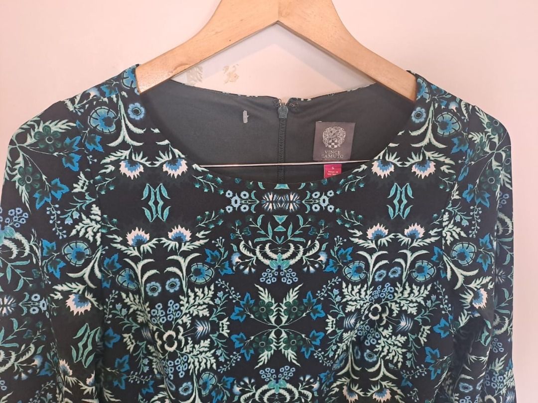Vince Camuto dress (Category: Dresses) located in Mandaluyong City. Submitted by epicowl-c93c (Listing ID 1462220083, Image 3). Description: The image shows a Vince Camuto bell-sleeve dress featuring an intricate, symmetrical teal blue, green, and white floral damask pattern on a black background. The garment is crafted with a round neckline, a rear zipper closure, and is styled as a shift or A-line silhouette. med to large,.