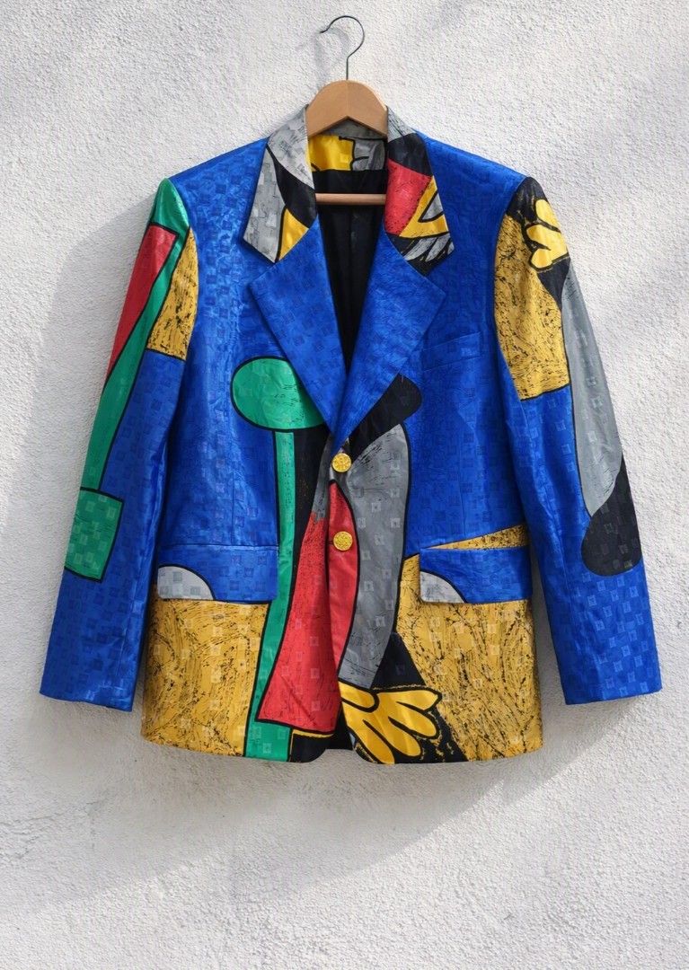 Vintage Picasso "Muses" Art Blazer (Category: Coats, Jackets and Outerwear) located in Baguio. Submitted by luxeloom099 (Listing ID 1462255921, Image 3). Description: Vintage Picasso "Muses" Art Blazer Make a bold statement with this iconic piece of 1990s wearable art. This vibrant, satin-finish blazer features an all-over cubist print inspired by Picasso’s muses, set against rich royal blue and primary geometric blocks. Perfect for collectors an