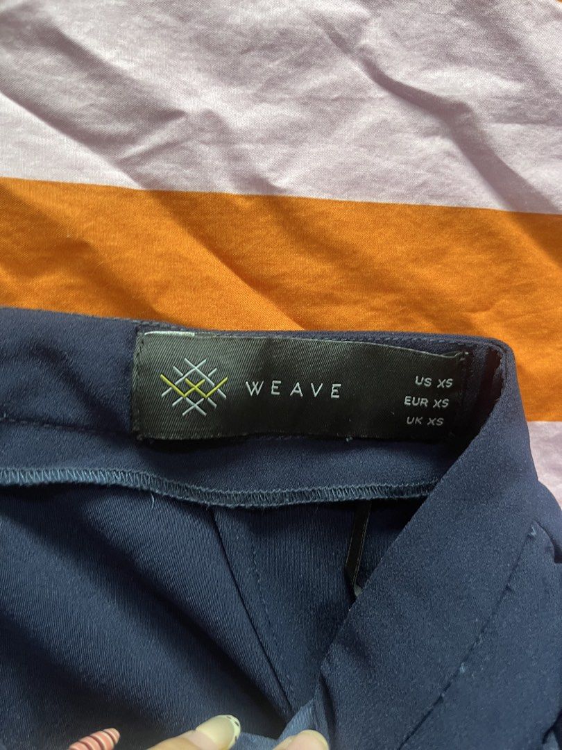 WEAVE Navy Blue Ruffle Front Cropped Pants (Category: Other Bottoms) located in Mandaluyong City. Submitted by hopeworldplane (Listing ID 1462156096, Image 2). Description: - Navy blue cropped pants from WEAVE - Features a cute ruffle detail on the front - Zipper closure at the back - Perfect for dressing up or down.