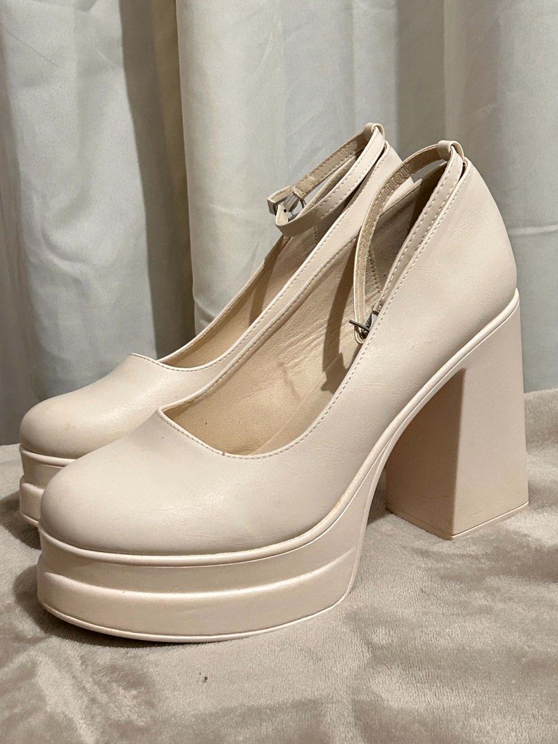 White 5in heels platform sandals (Category: Wedges) located in Davao. Submitted by brownbear97 (Listing ID 1462076149, Image 1). Description: SIZE IS US11/ EU41 Used only once. Still in mint condition .