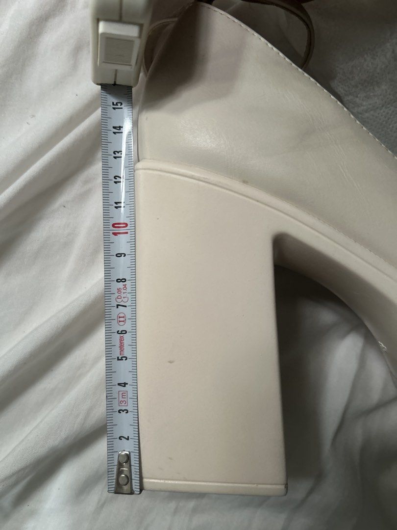 White 5in heels platform sandals (Category: Wedges) located in Davao. Submitted by brownbear97 (Listing ID 1462076149, Image 3). Description: SIZE IS US11/ EU41 Used only once. Still in mint condition .