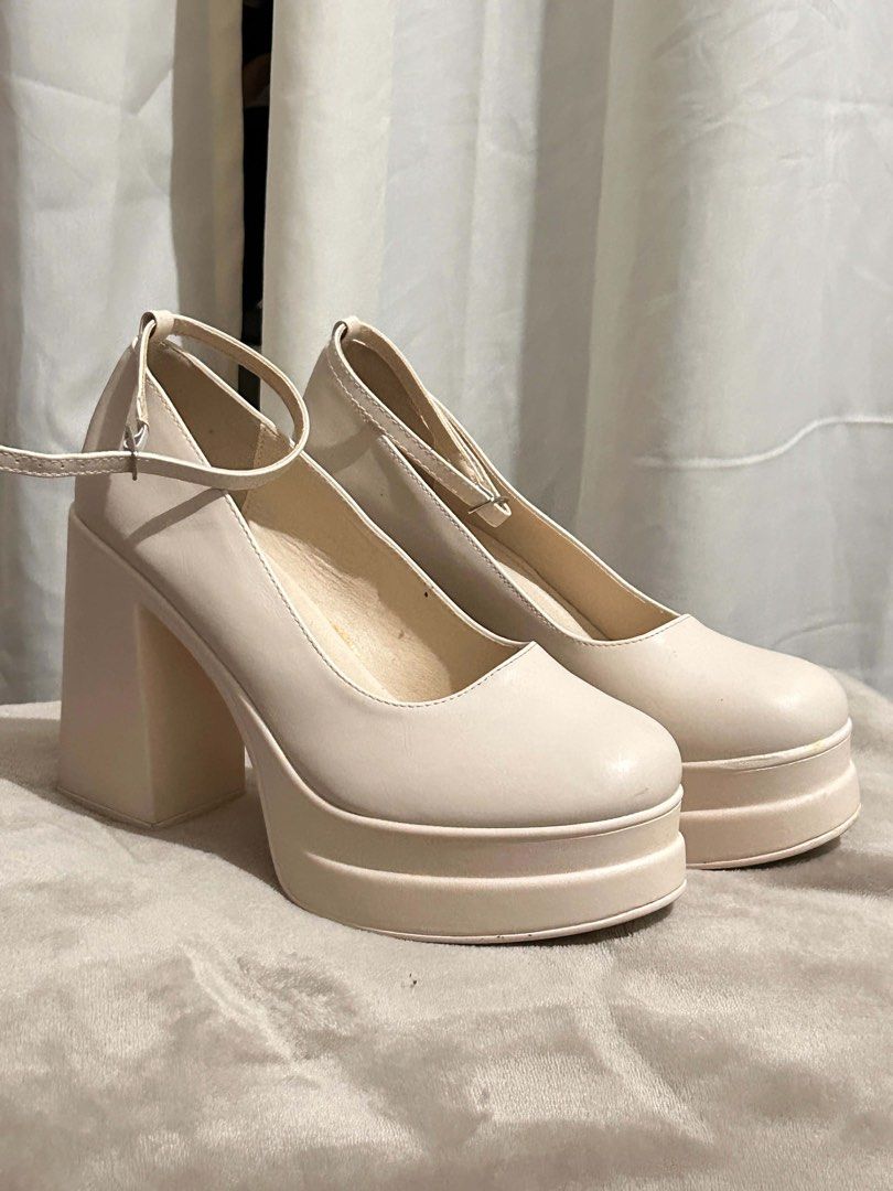 White 5in heels platform sandals (Category: Wedges) located in Davao. Submitted by brownbear97 (Listing ID 1462076149, Image 2). Description: SIZE IS US11/ EU41 Used only once. Still in mint condition .