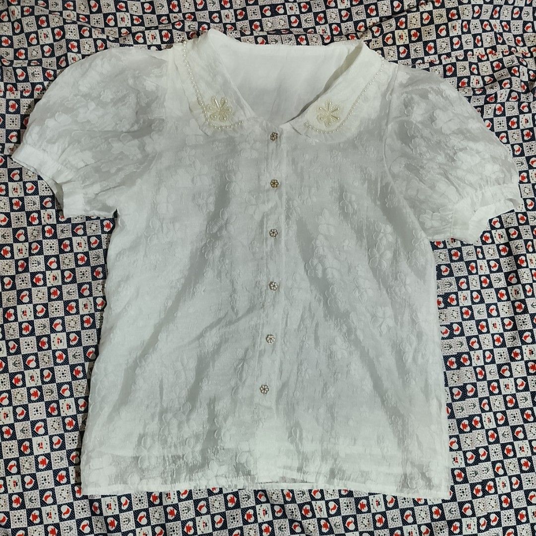 White Beaded Collar Short Sleeve Blouse / Button-Down Top (Category: Blouses) located in Santa Rosa. Submitted by prlvdbyellie (Listing ID 1462119094, Image 2). Description: Size L on tag but best fit size Medium to Semi large only ​#whiteblouse #beadedcollar #buttondown #puffleeves #coquette #dainty #prelovedph #thriftph #carousellph.