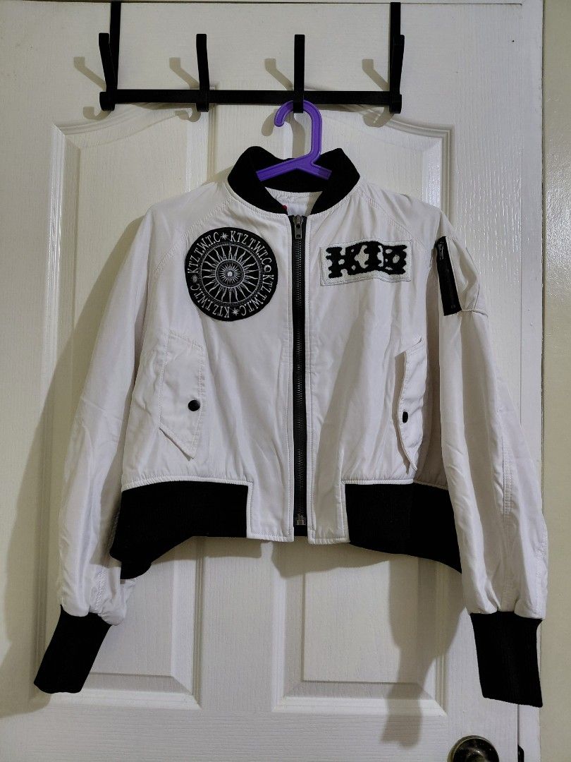 White Bomber Jacket with Black Accents (Category: Coats, Jackets and Outerwear) located in Manila. Submitted by plath-itudes (Listing ID 1462218709, Image 1). Description: high quality jacket for street fits! 🫶 - white bomber jacket - black ribbed cuffs and collar - very eye-catching design at the back 🤍 - two front pockets with button closures - zipper closure down the front size: can fit S-M, possibly L (baggy siya).