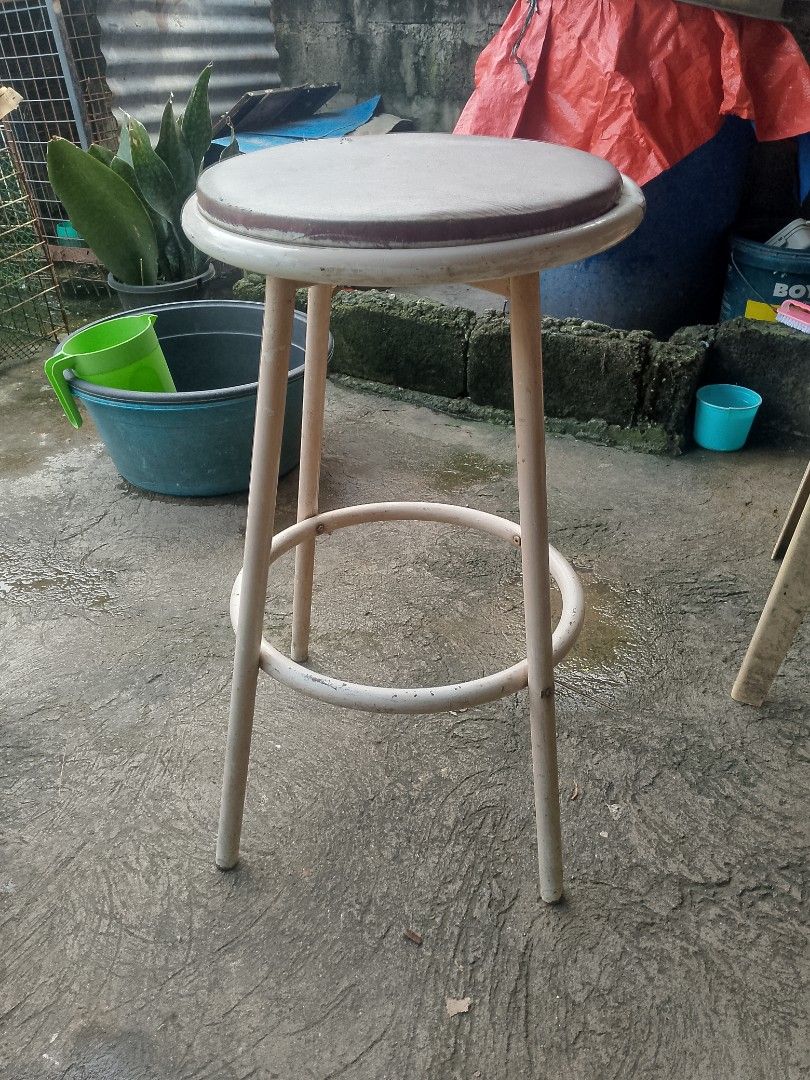 White Metal Bar Stool with Round Seat (Category: Chairs) located in Taguig. Submitted by generygwap31973 (Listing ID 1462087256, Image 1). Description: - White metal bar stool - Comfortable padded round seat - Sturdy circular footrest connecting legs - Ideal for kitchen counters or bar areas - Shows minor scuffs on paint, but is overall sturdy - Ready for a new home!.
