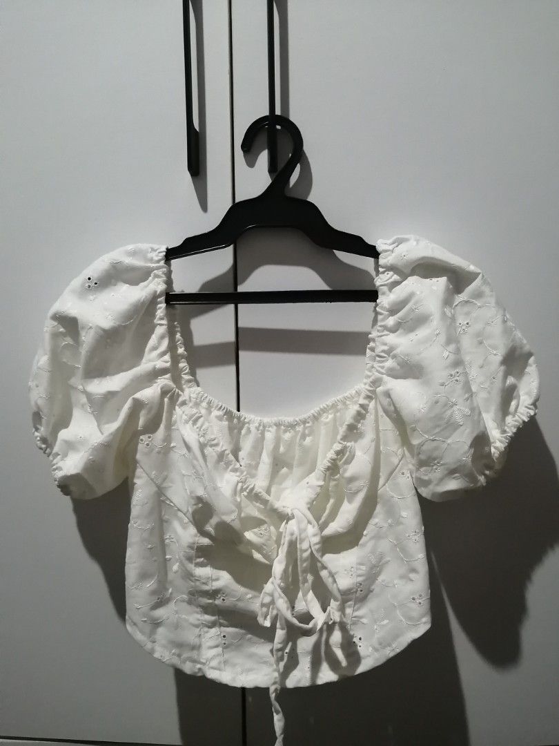 White Puff Sleeve Square Neck Crop Top (Category: Blouses) located in Santa Rosa. Submitted by ciacloset (Listing ID 1462136912, Image 1). Description: Nice quality in person No issue Fits small-med - White crop top - Puff short sleeves with elastic cuffs - Square neckline with tie front - All-over eyelet embroidery - Cute and summery vibe - Ideal for casual wear.