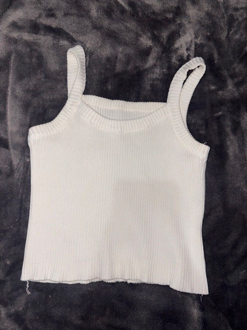 White Ribbed Square Neck Tank Top (Category: Sleeveless) located in Manila. Submitted by scoobydoo_clothing (Listing ID 1462211042, Image 2). Description: - Basic white ribbed tank top - Square neckline with thick straps - Raw hem detail - Stretchy material for a comfortable fit - Versatile: great for layering or wearing on its own - Effortlessly pairs with any wardrobe staple.