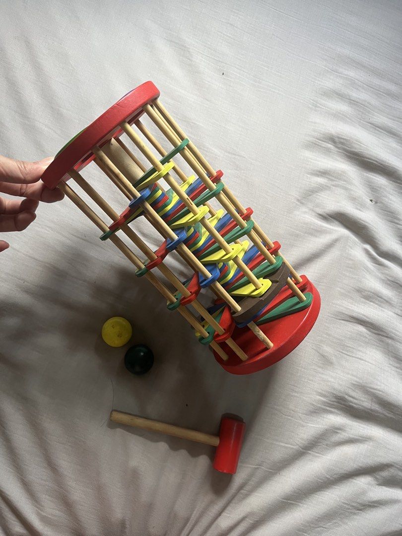 Wooden Ball Hammer Toy with Roller Drum (Category: Educational & Learning Toys) located in Manila. Submitted by babyfiedbyz (Listing ID 1462076405, Image 1). Description: - Wooden toy set perfect for little ones. - Features a roller drum with colorful rings. - Comes with a wooden hammer. - Includes two small balls (yellow and dark green). - Excellent for developing motor skills and hand-eye coordination. - Fun and engaging for toddlers and young 