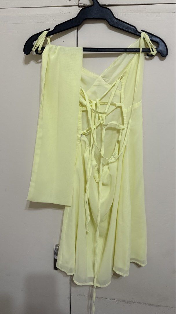 Yellow Backless Mini Dress with Scarf (Category: Dresses) located in Taguig. Submitted by lovedbynicx (Listing ID 1462130628, Image 2). Description: - Cute yellow mini dress - Halter neck with tie-up back - Comes with a matching scarf (versatile styling) - Lightweight and flowy material - Perfect for parties or nights out - Worn only once for a photoshoot.