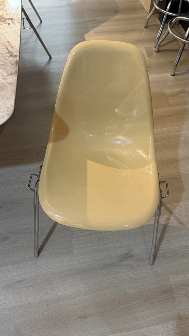 Yellow chair (Category: Chairs) located in Manila. Submitted by shopelisse (Listing ID 1462055980, Image 3). Description: - Cream-colored molded plastic chair - Sleek chrome legs - Versatile: Great for dining tables or as an accent chair - Comfortable and stylish design - Easy to clean surface - Fits modern or retro-themed spaces.