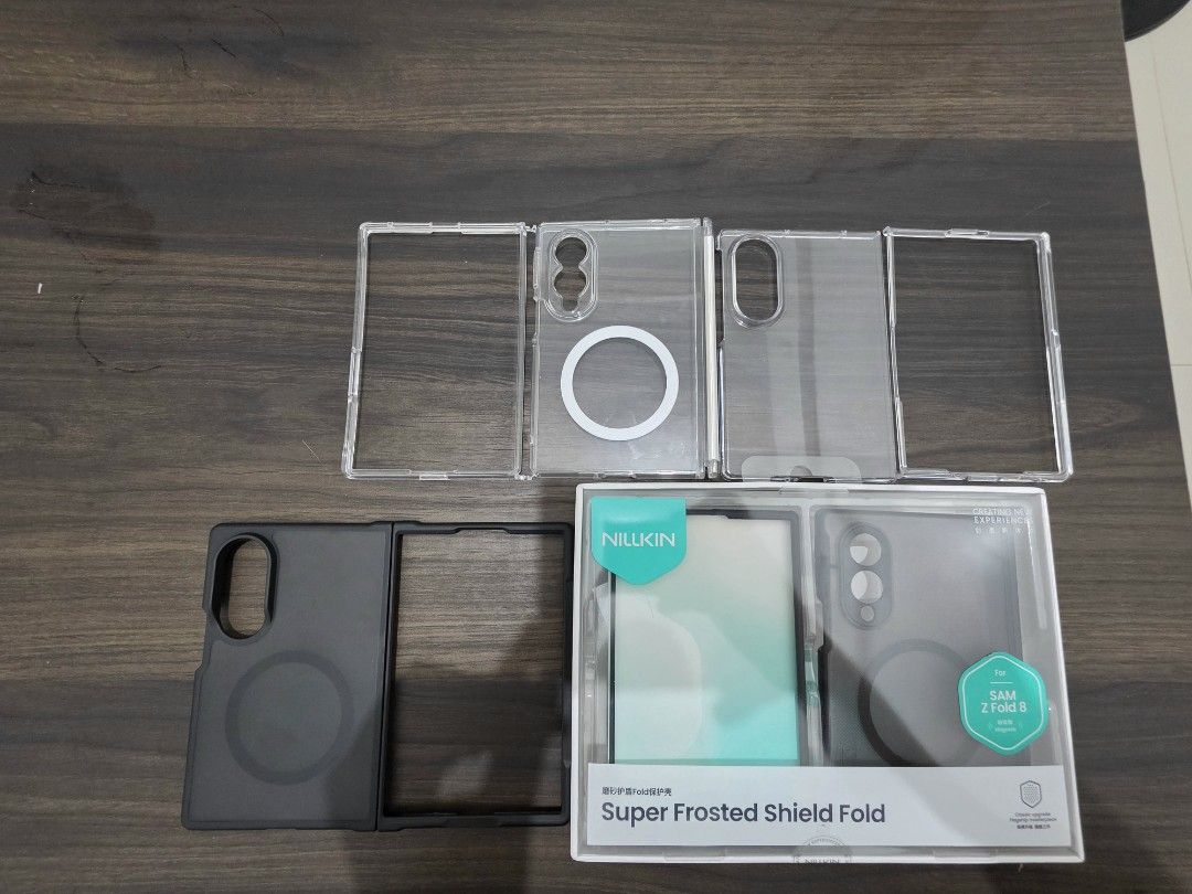 Z Fold 8 Bundle Case (Category: Cases & Sleeves) located in Manila. Submitted by jayseun (Listing ID 1462075635, Image 2). Description: From left to right: Ringke case with hinge cover (no box) Clear hard generic case (no box) Black MagSafe case (no box) Nillkin Super Frosted Shield Selling as pack for only 2000.