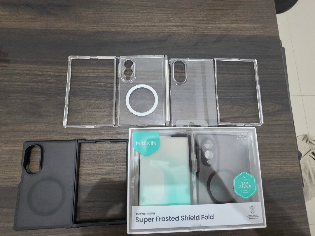 Z Fold 8 Bundle Case (Category: Cases & Sleeves) located in Manila. Submitted by jayseun (Listing ID 1462075635, Image 3). Description: From left to right: Ringke case with hinge cover (no box) Clear hard generic case (no box) Black MagSafe case (no box) Nillkin Super Frosted Shield Selling as pack for only 2000.