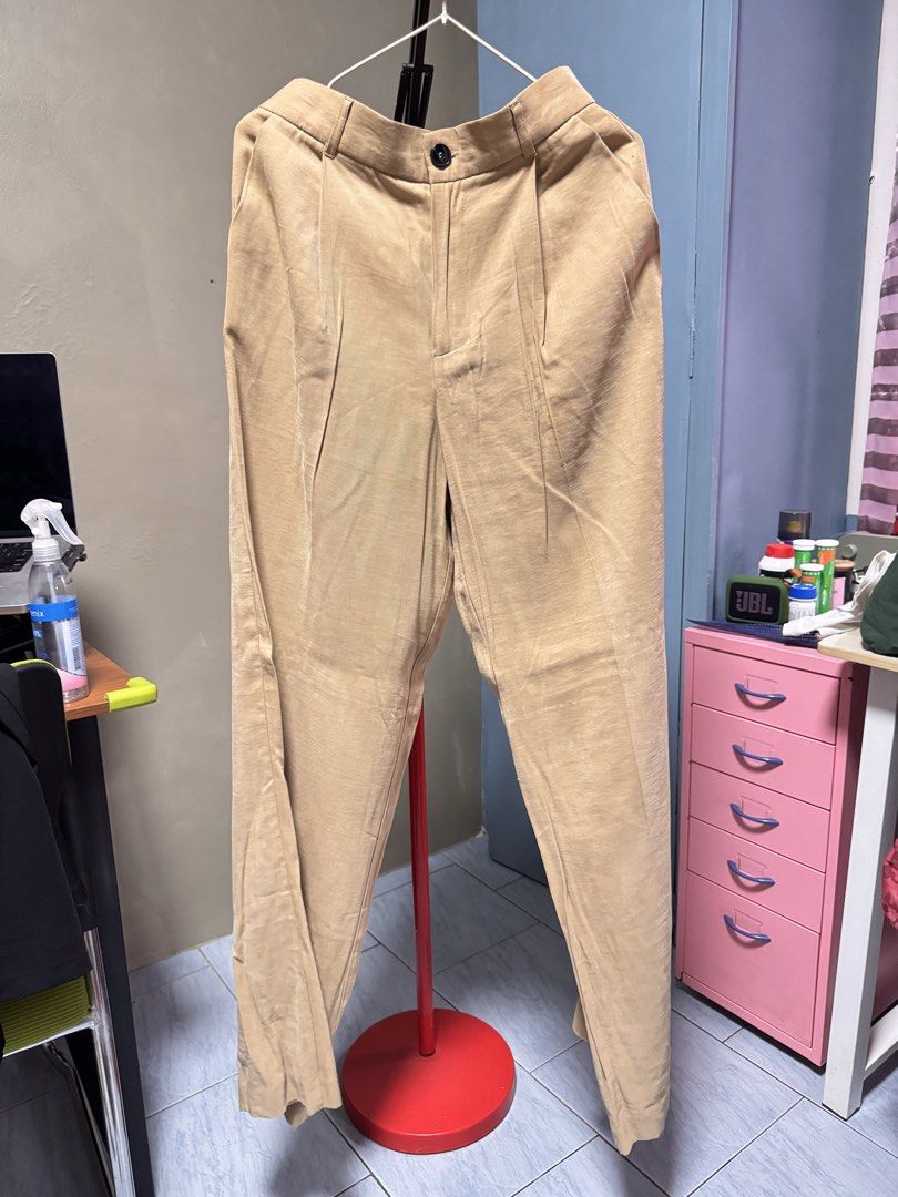 ZARA Beige Pleated Trousers (Category: Other Bottoms) located in Quezon. Submitted by thriftream (Listing ID 1462214532, Image 1). Description: - Zara Beige Corduroy Pants - Never been used - High-waisted with front pleats - Wide leg style - Size: US M / MEX 28 - Waist measurement: Approx. 14 inches across - Perfect for casual or dressed-up looks - Cut out tags but no other issue .