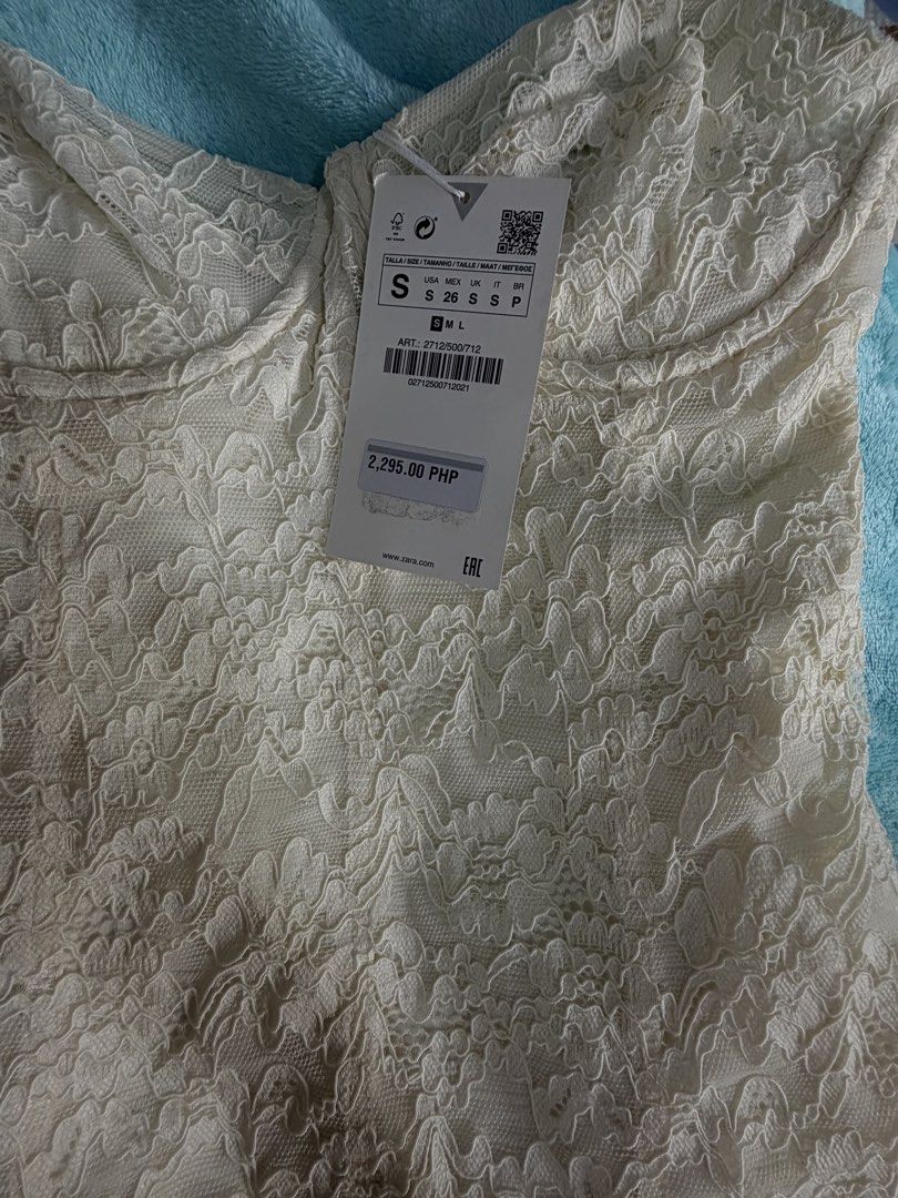 Zara lace mini dress (Category: Dresses) located in Taguig. Submitted by aileenraymnd (Listing ID 1462095049, Image 3). Description: Brand new Zara lace mini dress in cream/off-white with underwire bustier detail. IMPORTANT PLEASE READ!! Condition: New with tag but has two minor flaws noted in the close-up photos: - Slight fraying/loose thread at the center front bust wire. - A small loose seam/thread near the top back edge. - Runs small RFS : do