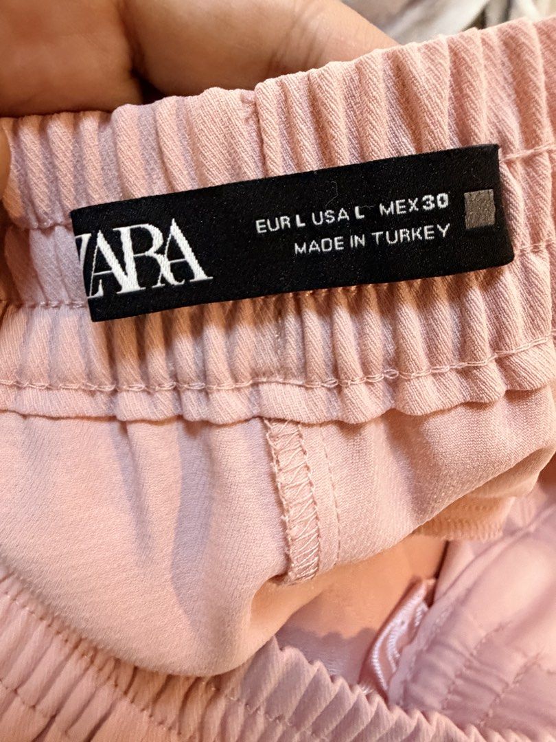 Zara pink trousers (Category: Other Bottoms) located in Quezon City. Submitted by bloompicks (Listing ID 1462138478, Image 3). Description: Used once only. Like new. No issues. Garterised waist W: 17-21 when laid flat (can be tightened) L: 37.