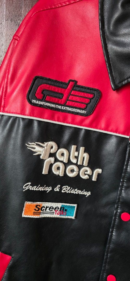 ZARA Red & Black Varsity Jacket (Category: Coats, Jackets and Outerwear) located in Santa Maria. Submitted by ellahqy28 (Listing ID 1462181746, Image 3). Description: - Cool red and black varsity jacket from ZARA. - Features embroidered details and patches. - Racing or biker style design. - Button-up front closure. - Ideal for a streetwear look. - Check photos for all graphics..