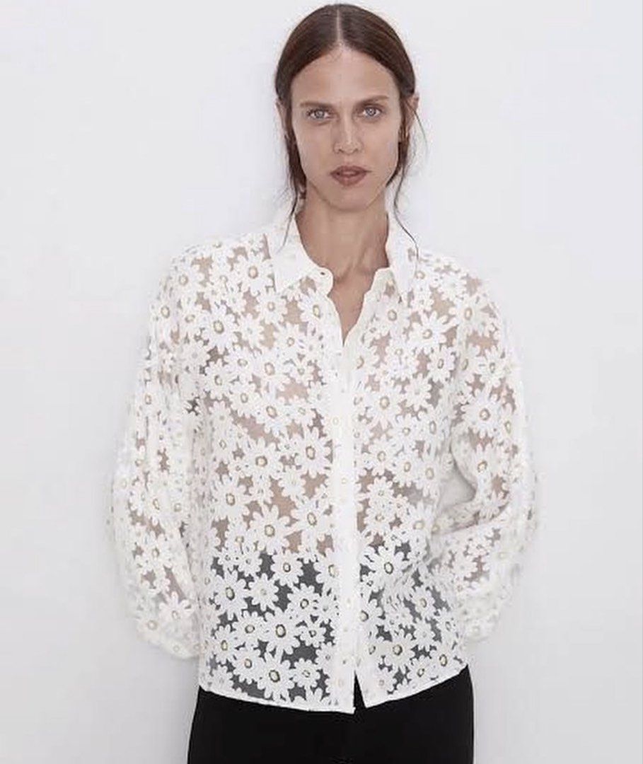 Zara White Daisy Lace Button-Up Blouse (Category: Blouses) located in La Trinidad. Submitted by rare_closet_finds (Listing ID 1462113572, Image 1). Description: - White sheer blouse -armpit to armpit 20” -length 22” - Daisy lace overlay; excellent condition - Button-up front with collar - Long balloon sleeves with elastic cuffs - Versatile: pairs well with pants or skirts - Delicate and pretty aesthetic.