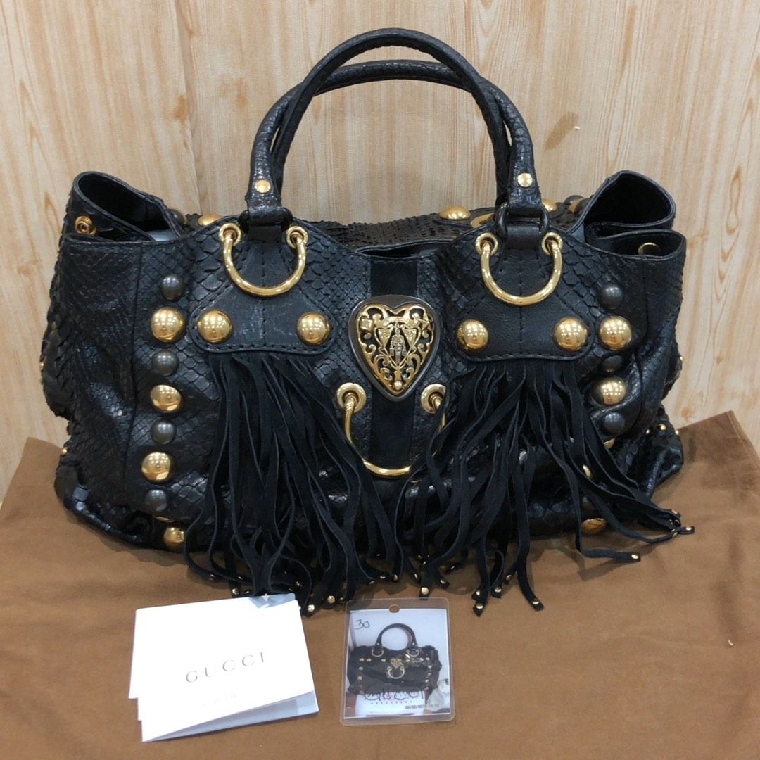 267008908 GUCCI BAG 207301 PYTHON WITH FRINGE (Category: Luxury Bags & Wallets) located in Taguig. Submitted by ecoring.ph (Listing ID 1462282444, Image 2). Description: ◆CONDITION: B ◆DESCRIPTIONS: (Other defects/info:) OUTER: The body of the bag has scratches, scuffs, stains, and dirt, wrinkles, deformed, press marks, and shows signs of use. The bottom and bottom corners of the bag are also has scratches, scuffs, stains, and dirt, wrinkles, def