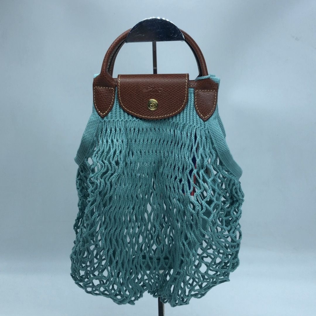 267008966 LONGCHAMP BAG MEDIUM KNIT BLUE (Category: Luxury Bags & Wallets) located in Taguig. Submitted by ecoring.ph (Listing ID 1462281026, Image 1). Description: ◆CONDITION: AB ◆DESCRIPTIONS: (Other defects/info:) The flap and top handle of the bag have minimal scratches and press marks. The rubber lining of the bag has a minor crack. Overall, the bag remains in good, new condition. ◆SIZE: ⁎WIDTH: 34cm. (approximately only) *HEIGHT: 30cm. (app
