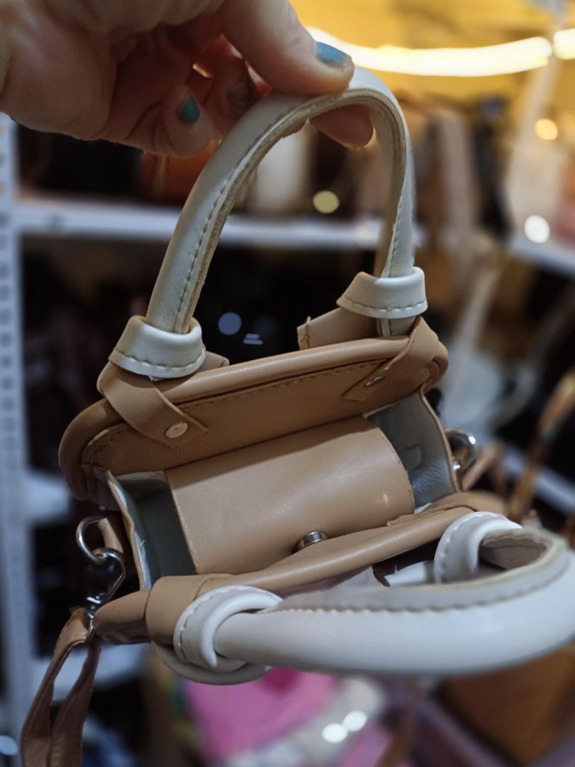 2-way mini sling bag crossbody bag (Category: Cross-body Bags) located in Bocaue. Submitted by bags.and.beyond (Listing ID 1462318874, Image 3). Description: in good condition but needs cleaning sa inside part.