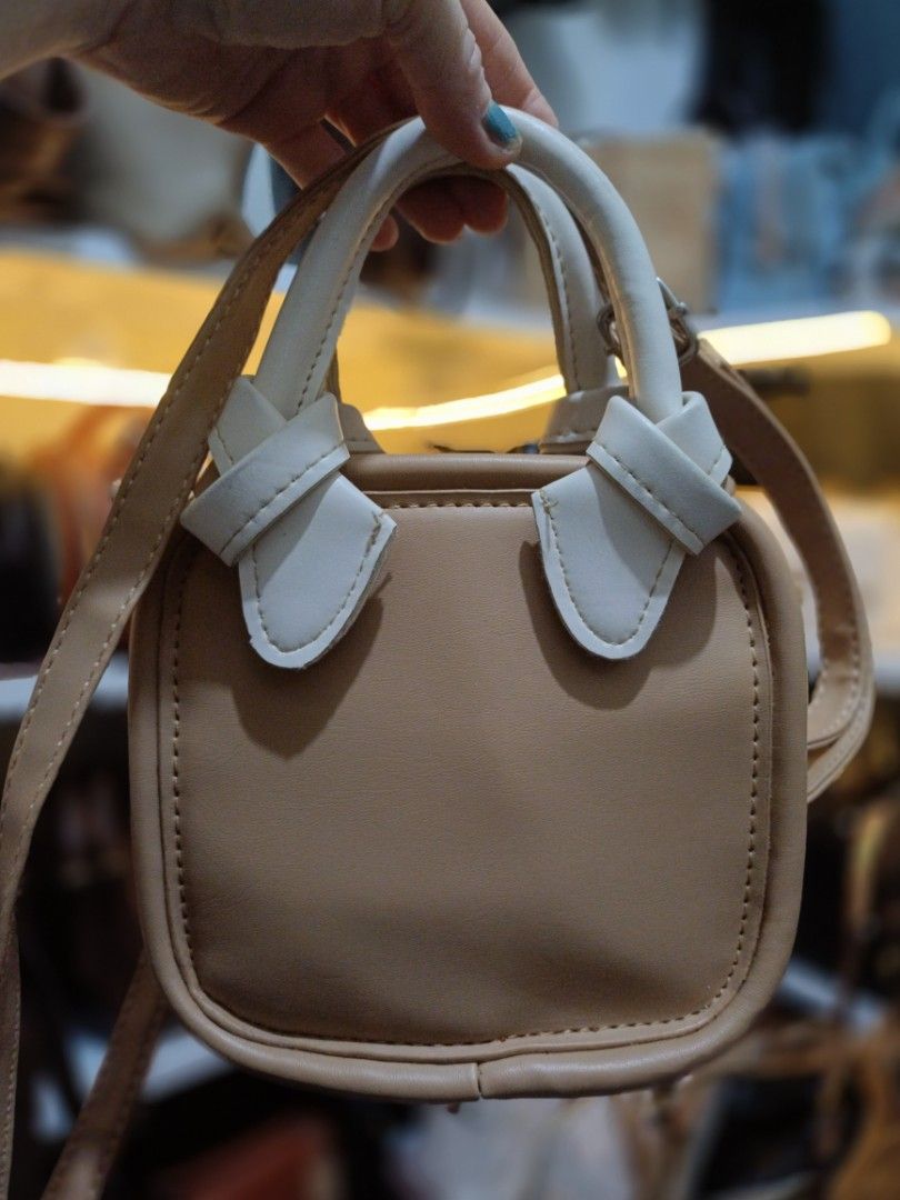 2-way mini sling bag crossbody bag (Category: Cross-body Bags) located in Bocaue. Submitted by bags.and.beyond (Listing ID 1462318874, Image 2). Description: in good condition but needs cleaning sa inside part.