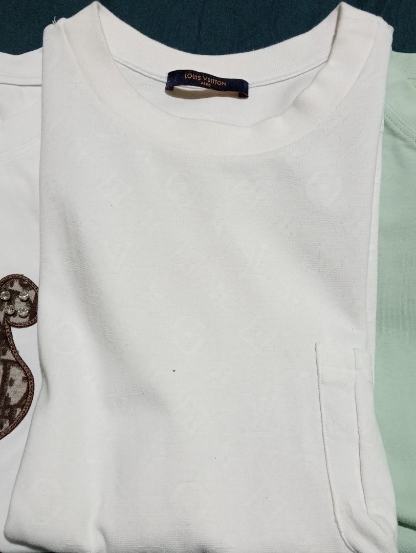 3 T-shirts: Dior Bear, LV Monogram, Ami Paris (Category: Shirts) located in Caloocan City. Submitted by yazzielux (Listing ID 1462432907, Image 2). Description: - White tee featuring a cool Dior-style bear graphic. - White tee with an all-over Louis Vuitton monogram pattern. - Light green Ami Paris t-shirt. - Essential basics to elevate your everyday style..