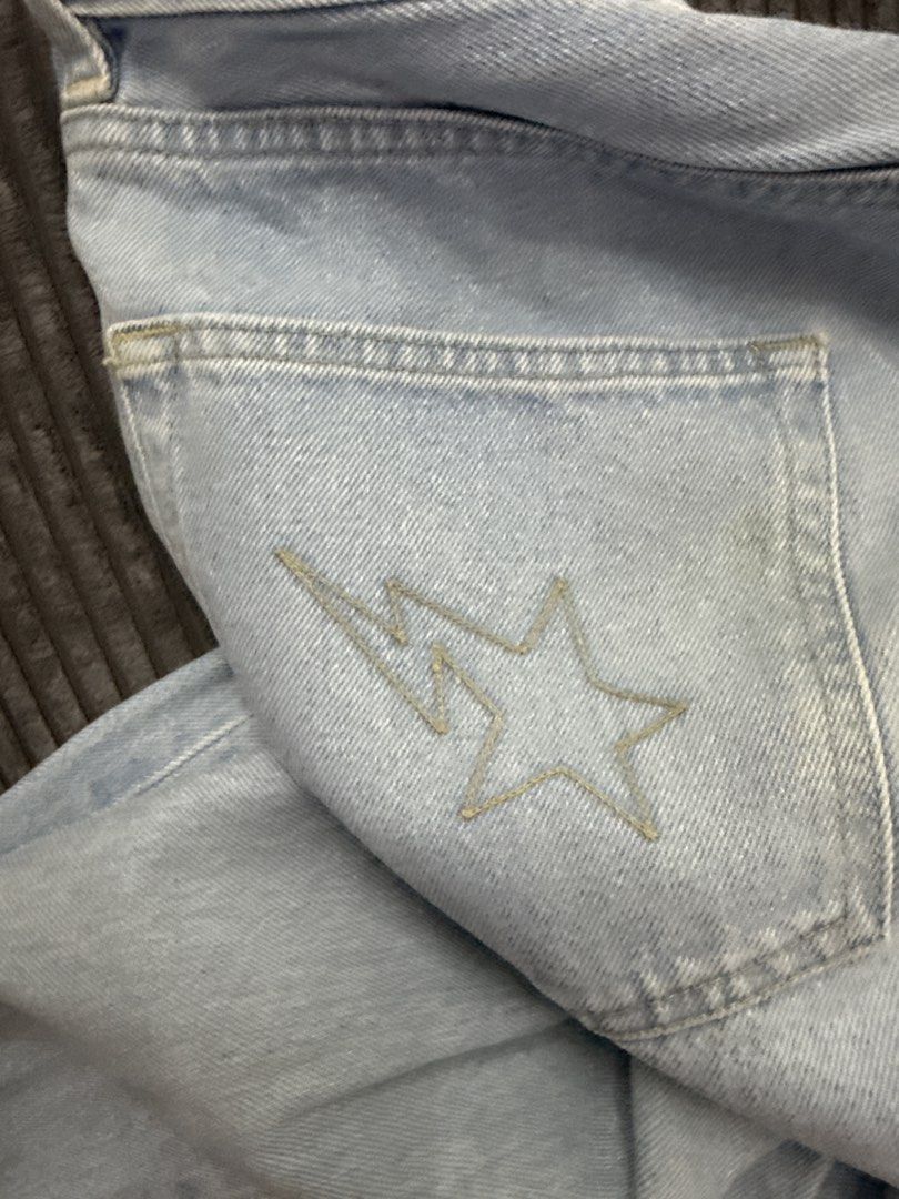 A Bathing Ape BAPE Light Wash Denim Jeans L (Category: Voice Recorders) located in Angeles City. Submitted by migs_font29 (Listing ID 1462395062, Image 3). Description: - Brand: A Bathing Ape (BAPE) - Type: Light Wash Denim Jeans - Size: L - Material: 100% Cotton - Origin: Made in Japan - Features: Iconic BAPE star logo embroidered on back pocket.