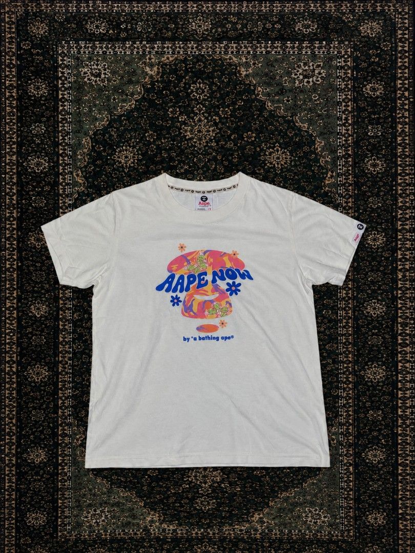AAPE now white graphic tee (Category: Tshirts & Polo Shirts ) located in Aroroy. Submitted by reibi929 (Listing ID 1462391954, Image 1). Description: Brand: bathing ape • Size: Small (S) • Fit: Regular Fit • Width: 15in • Length: 24in.