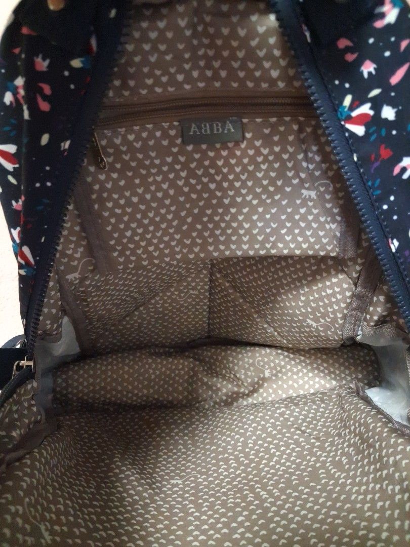 ABBA Backpack - Navy Floral Print (Category: Backpacks) located in Angeles City. Submitted by anneps (Listing ID 1462406264, Image 3). Description: - Cute navy backpack with a fun floral print. - Features multiple inner pockets for organization. - Smoothly working zippers. - Adjustable straps for a comfortable fit. - Ideal for everyday use or travel. - Approximately 15 inches tall..