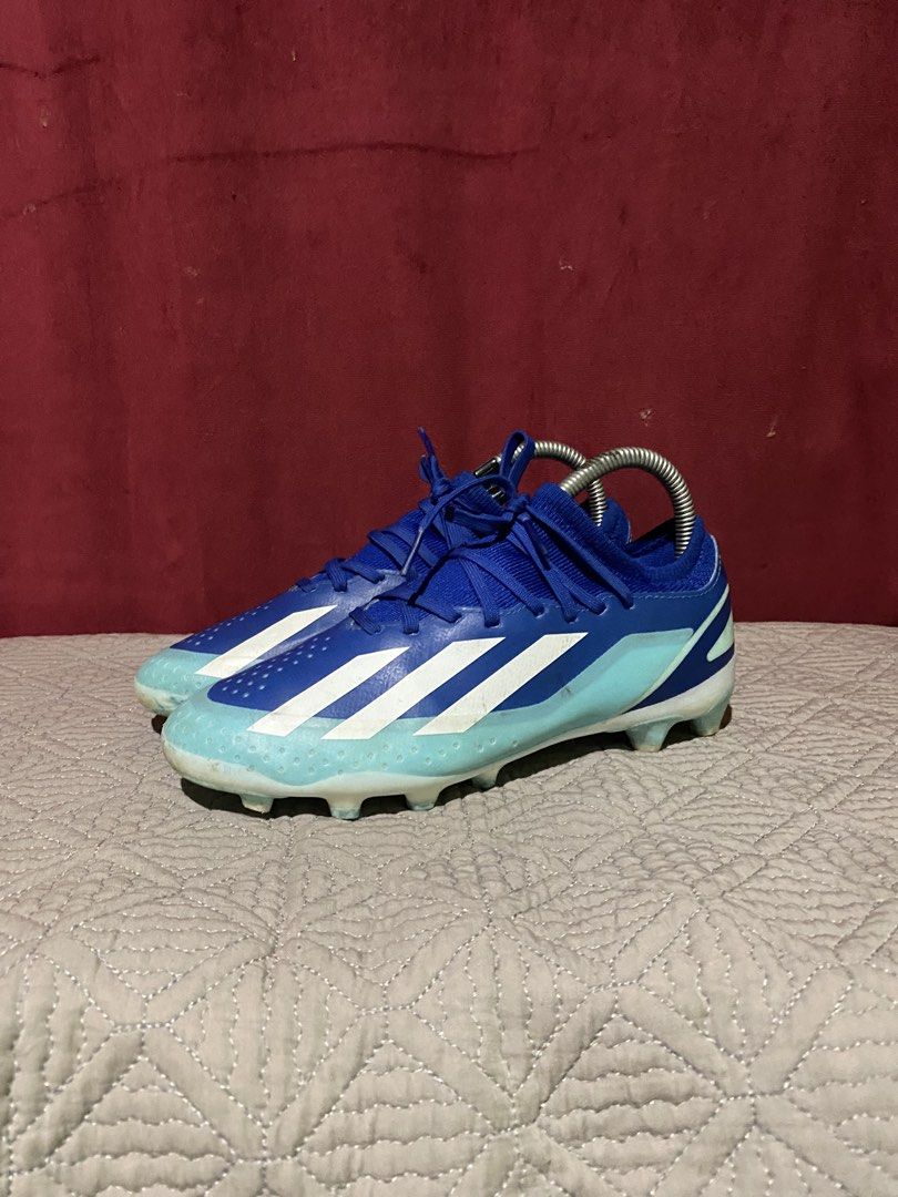 Adidas Blue Soccer Cleats Crazyfast (Category: Racket and Ball Sports) located in Manila. Submitted by clark_thrift (Listing ID 1462307965, Image 1). Description: - Adidas Crazyfast soccer cleats - Color: Blue - Size: 5 UK / 5.5 US - Type: Football boots for firm ground - Features: Synthetic upper, firm ground studs - Condition: Used, with minor dirt on soles.