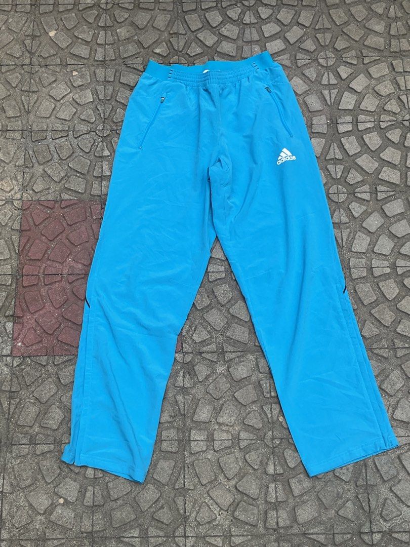 Adidas Blue Track Pants Joggers (Category: Joggers) located in Mabalacat. Submitted by epicforest_78284 (Listing ID 1462264019, Image 1). Description: - Blue Adidas track pants - Elastic waistband with drawstring - Two front zip pockets - Adidas logo on right leg - Ideal for sports or casual wear - Comfortable and lightweight.