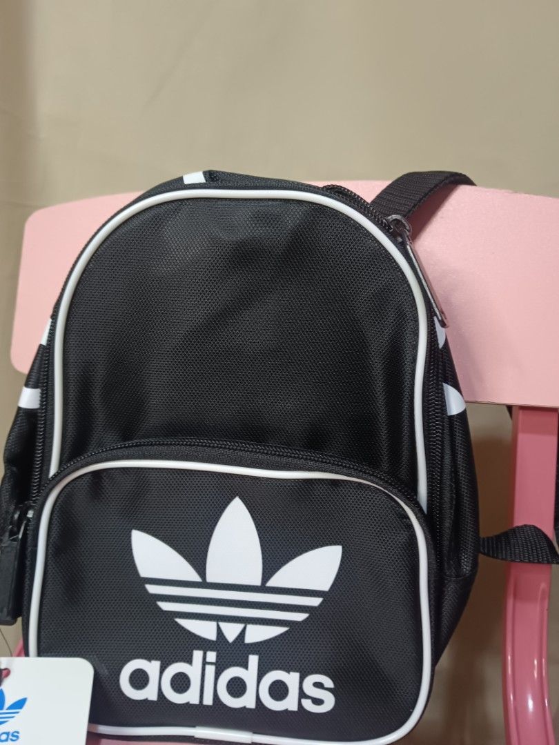 Adidas Mini Backpack - Black or Red (Category: Backpacks) located in Manila. Submitted by rabpisces23 (Listing ID 1462435714, Image 1). Description: - Cute Adidas mini backpacks - Available in black or red - Features the classic Adidas trefoil logo - Perfect for carrying essentials - Great for everyday use or travel - Get yours now!.