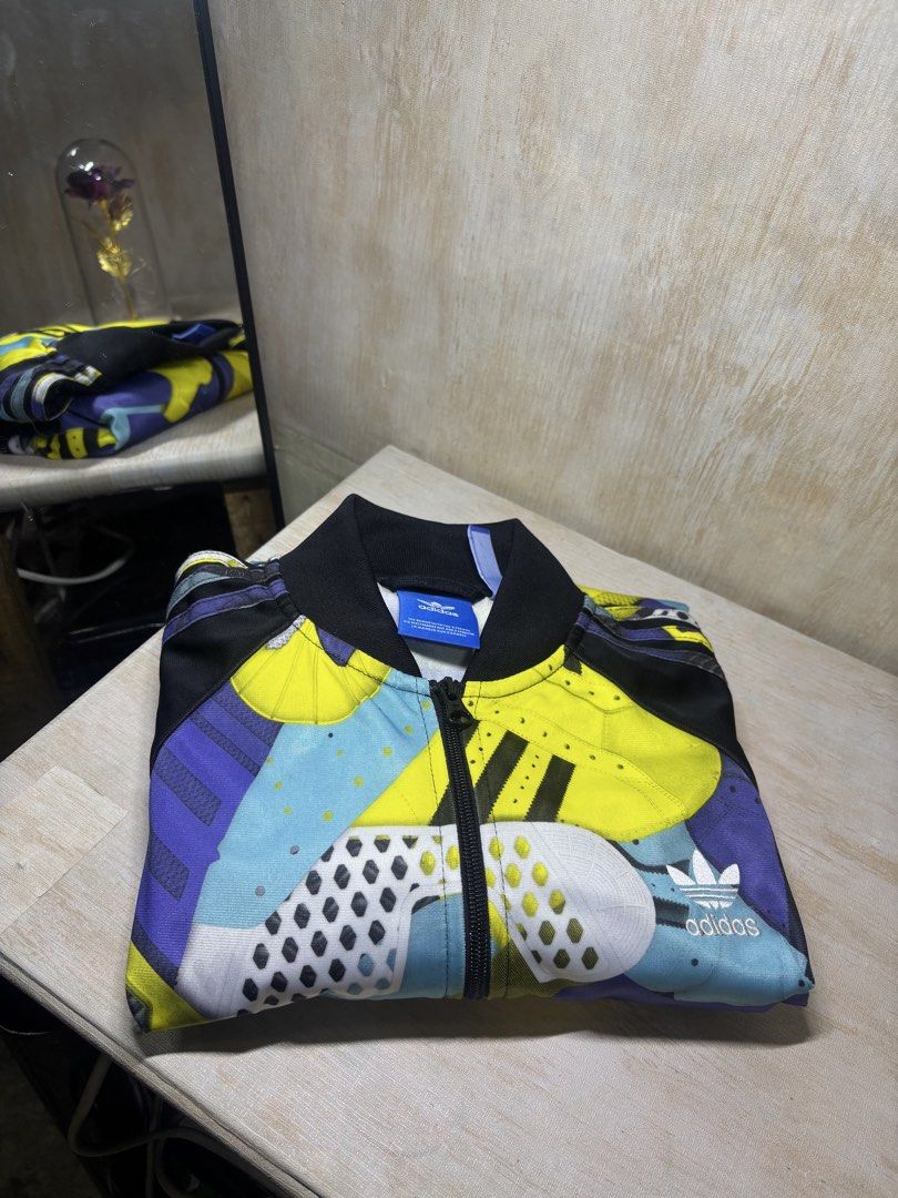 ADIDAS MONTAGE TRACK JACKET (Category: Coats, Jackets and Outerwear) located in Cabuyao City. Submitted by pormanation-thrift-store (Listing ID 1462301091, Image 2). Description: ADIDAS MONTAGE TRACK JACKET Condition: LIKE NEW Color rate: 10/10 (PWEDE SA MASELAN) Size: MEDIUM Dimes: 22"Wx26.5"L Issue: NONE‼️ Price: 1200.