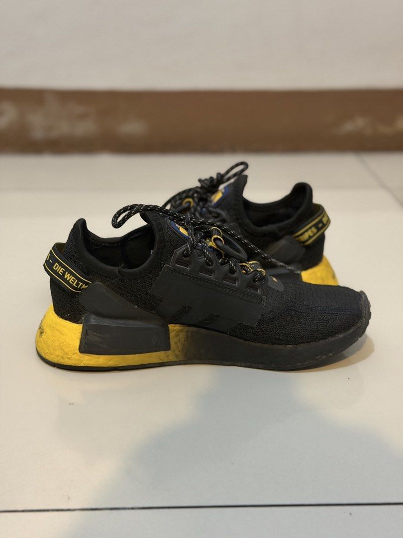 Adidas NMD R1 V2 Black Gradient Yellow (Category: Sneakers) located in Pasig City. Submitted by jgbeautique (Listing ID 1462424537, Image 2). Description: Original price was 1100HKD (7626Php) Bought in HK Still in very good condition Only flaw is that I lost the insole as seen in photo #3 You can use any of your insoles as replacement US 7 for women US 5 for men RFS: Decluttering.