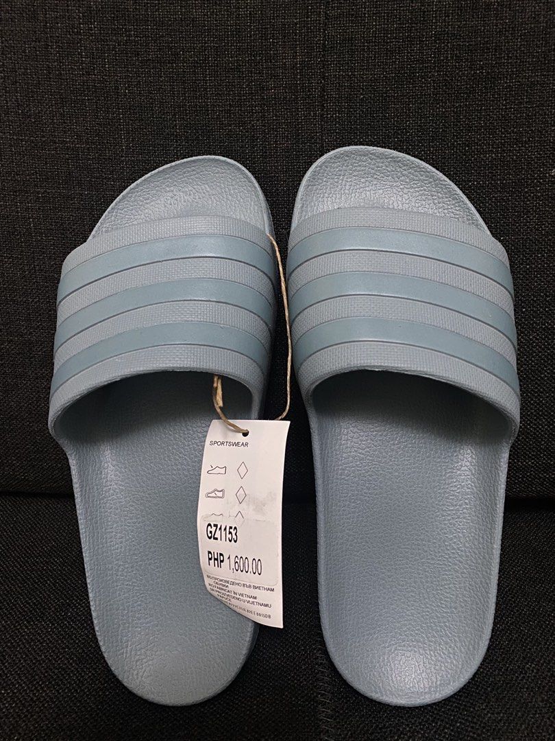 Adidas Slides 💯OG (Category: Slippers and slides) located in Manila. Submitted by s.itemseller (Listing ID 1462337907, Image 1). Description: size - US 5 brandnew model- Adilette Aqua .