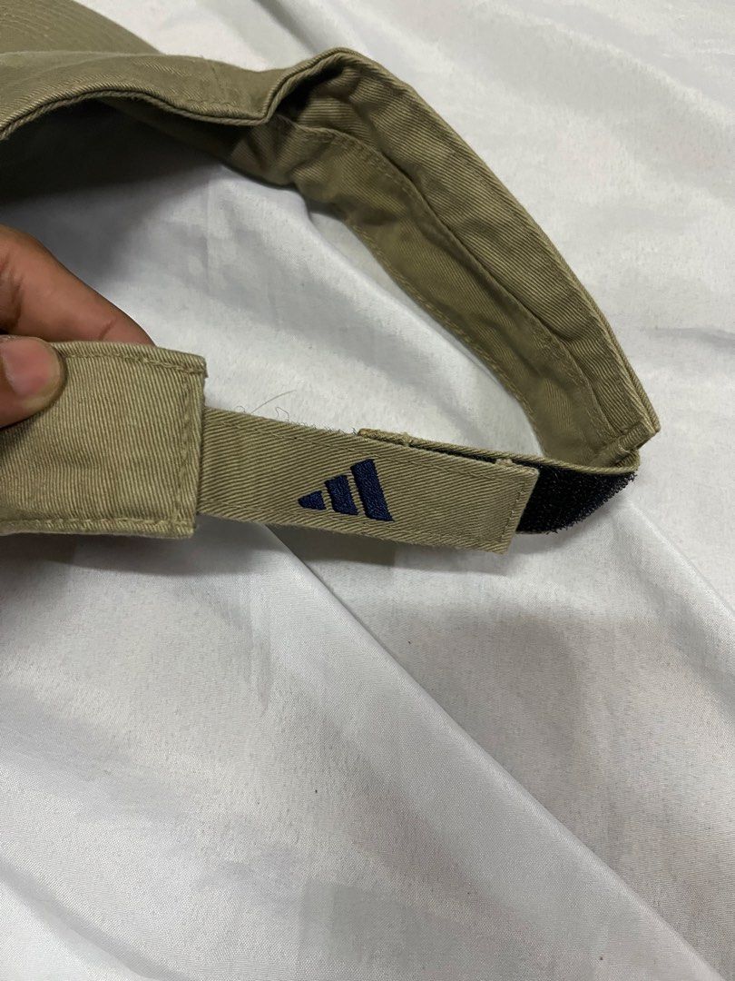 Adidas Sun Visor Cap Khaki (Category: Caps & Hats) located in Muntinlupa City. Submitted by ninenine.collective (Listing ID 1462265321, Image 2). Description: Adidas Sun Visor Cap Khaki.