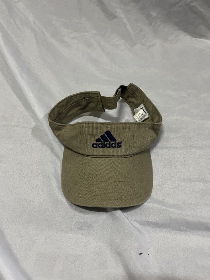 Adidas Sun Visor Cap Khaki (Category: Caps & Hats) located in Muntinlupa City. Submitted by ninenine.collective (Listing ID 1462265321, Image 1). Description: Adidas Sun Visor Cap Khaki.