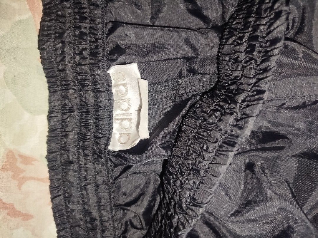 Adidas Tearaway Track Pants (Category: Joggers) located in Quezon City. Submitted by y2k_thriftkid (Listing ID 1462276696, Image 3). Description: - Classic Adidas tearaway track pants - Color: Black with white stripes - Full snap buttons on both legs for easy on/off - Elastic waistband with drawstring - Ideal for sports or casual wear.