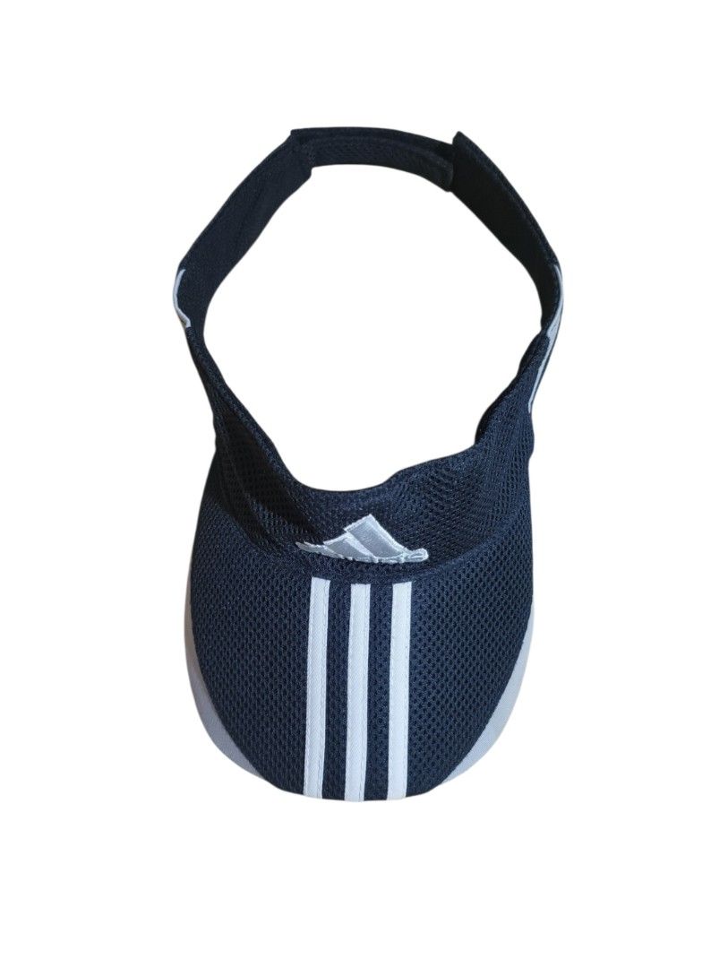 Adidas Visor Cap Hat 3-Stripes Mesh Adjustable (Category: Caps & Hats) located in Talisay. Submitted by rubiobryle20102 (Listing ID 1462389238, Image 3). Description: - Adidas visor - Color: Dark blue with white 3-stripes and logo - Material: Breathable mesh - Features: Adjustable strap at the back - Ideal for: Sports, sunny days - Condition: Clean and ready to wear 380 Free shipping📥.