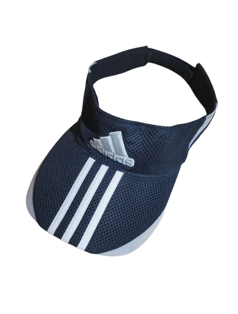 Adidas Visor Cap Hat 3-Stripes Mesh Adjustable (Category: Caps & Hats) located in Talisay. Submitted by rubiobryle20102 (Listing ID 1462389238, Image 1). Description: - Adidas visor - Color: Dark blue with white 3-stripes and logo - Material: Breathable mesh - Features: Adjustable strap at the back - Ideal for: Sports, sunny days - Condition: Clean and ready to wear 380 Free shipping📥.