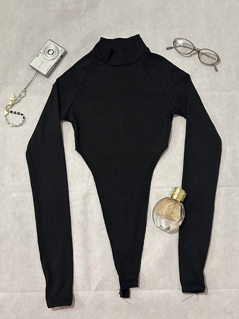 Adika black ribbed mock-neck high-cut bodysuit (Category: Longsleeves) located in Imus. Submitted by donnasaurr19 (Listing ID 1462353306, Image 1). Description: - Size XS on Tag but can fit to SMALL - Unused.