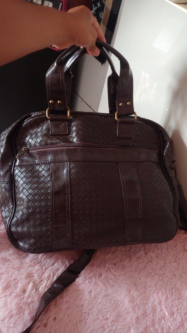ADRENA Brown Woven Leather Handbag Shoulder Bag (Category: Shoulder Bags) located in Kitaotao. Submitted by wilddolphin.0a0db3 (Listing ID 1462394825, Image 2). Description: - Stylish ADRENA brown handbag - Beautiful woven leather exterior - Comfortable top handles - Includes a detachable shoulder strap for versatility - Spacious interior with convenient pockets - Secure zipper closure - ADRENA branding visible on zipper pull and metal tag.