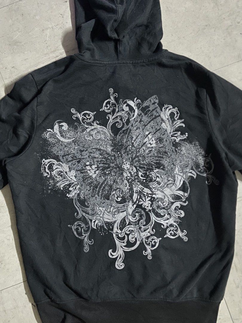 AFFLICTION HOODIE DESIGN VIBE (Category: Coats, Jackets and Outerwear) located in Manila. Submitted by reirapture (Listing ID 1462394874, Image 3). Description: - black zip-up hoodie - Features a striking butterfly graphic on the back - Convenient front pockets - Ideal for casual outfits and easy layering tags: y2k, Emo, grunge, affliction, MMA ELITE, tapout, XTREME COUTURE, juicy couture, punk, bimbo, MAY TAWAD SA CUTE.