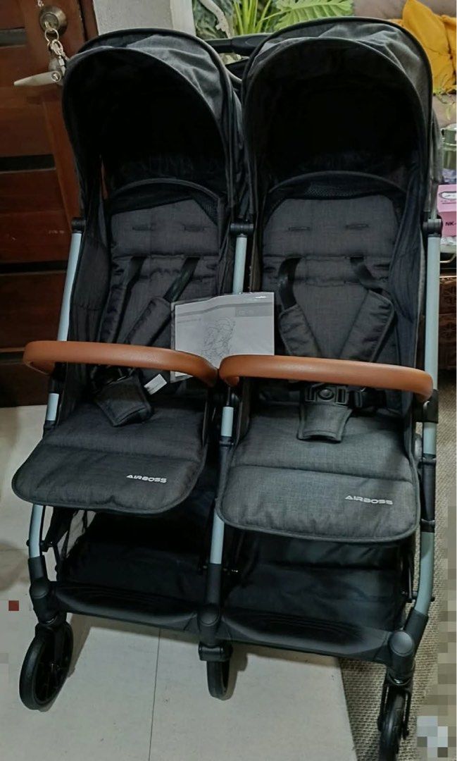 Airboss Twin Stroller (Category: Strollers) located in Dasmarinas. Submitted by filmsfromstellar (Listing ID 1462437702, Image 2). Description: - Airboss twin stroller, model CD-01 - Color: Dark grey fabric with brown leatherette handles - Lightweight and easy to maneuver - Safety harnesses for both seats - Folds for convenient storage - Includes original box & manual -from korea -mint condition -meet ups / delivery.